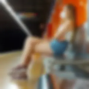 Candid Girl in Denim Shorts and a Mask Sitting With Crossed Legs on a Subway Station