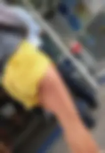 Skinny ass eating her yellow shorts