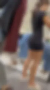 Girl Wearing Black Top And Tight Black Shorts (Upshots)
