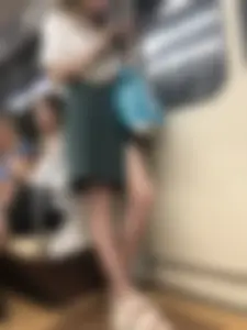 Tall candid girl in a skirt with very long and slim legs subway train creepshot
