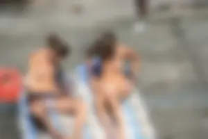 Two teens stripping and going topless to tan