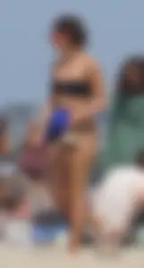 Two thick white girls in bikinis on the beach with big asses