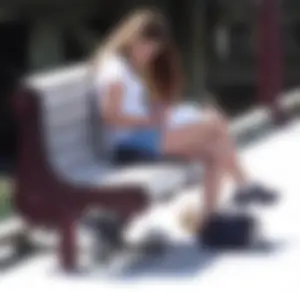 Pretty girl with a camera in little denim shorts