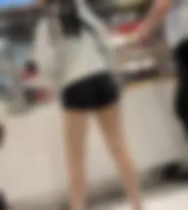 Asian girl in tight black shorts at the mall