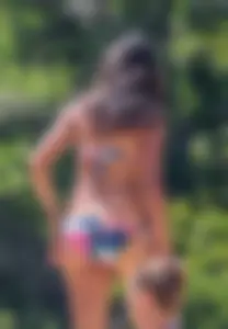 Group of sexy friends at the beach in bikinis