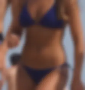 Two sexy friends, one blonde and one brunette, on the beach in bikinis