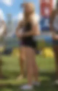 Cute blonde girl wearing shorts in the park