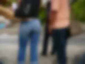 Red haired lady with a nice ass in tight jeans waiting for the bus