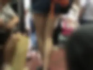 Girl in Shorts Standing in a Subway Train With Spread Legs - Creepshots Gallery