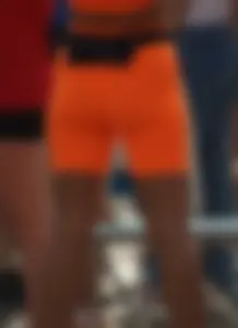 Athlete in Orange Spandex Outfit Stretching Legs VPL Candid Photos