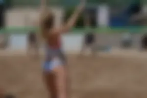 Beach volleyball blonde looking sexy and showing her body off