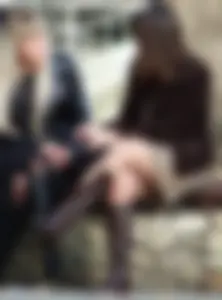 Stocky Girl in Gogo Boots, Pantyhose and Skirt Sitting Cross-Legged in the City Square