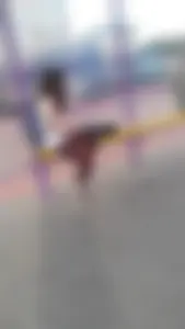 Cute skinny candid teen sitting at the bus station street photos