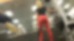 Very hot and sexy blonde at the gym working out in red leggings