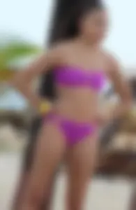 Sexy light skinned black girl in a purple bikini busted
