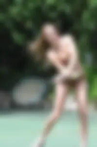 Two sexy girls playing tennis in bikinis