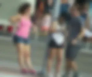 Couple of babes standing around in shorts