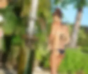 Beach shower girl with cute little ass in tiny black bikini