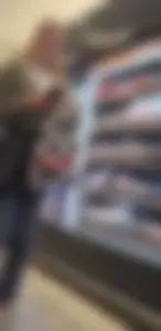 Girl wearing tight blue jeans at the store, closeups of her hot ass