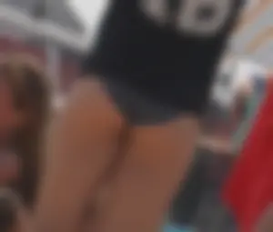A group of teens in bikinis on the beach