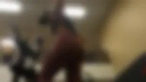 Smoking hot brunette working out at the gym in tight leggings