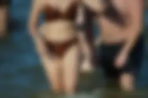Chubby Tummy and Legs in Swimsuit Closeup on the Beach