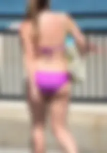 Sexy thick blonde girl in purple bikini