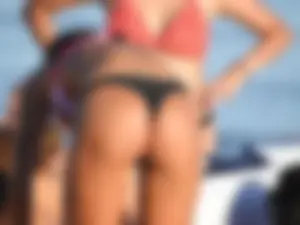 Fit girl with nice body in thong bikini on the beach