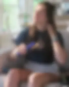 Cute Girl in Shorts Making Her Hair