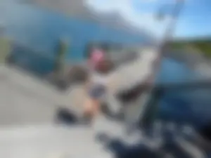 Pretty girl with a camera in little denim shorts