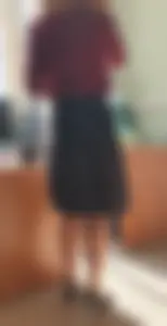 Hot teacher wearing stiletto heels and a skirt in classroom