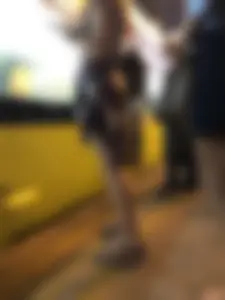 Cute Teen in Shorts on the Tram Stop