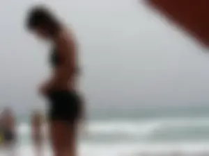 Hot topless girl on the beach in a thong bikini with a nice ass