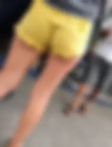 Skinny ass eating her yellow shorts