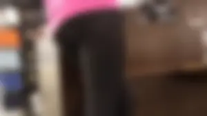Nice ass in leggings standing in line shopping
