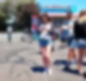 Cute girl walking in short jean shorts