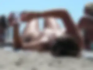 Girl with nice tits topless on the beach