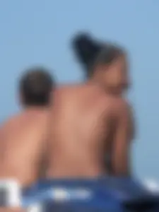 Hot ass topless beach girl with great tits lets her little brother oil up her ass in thong bikini