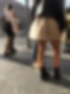 Nice legs, candid girl wearing a skirt and boots