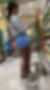 Latina Lady Lumps in blue spandex shorts