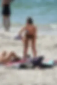 Sexy ass girl with a perfect body in her bikini on the beach