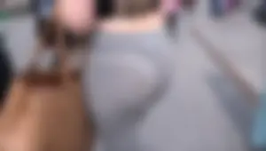 Sexy blonde with a thick booty walking around in see through grey leggings with vtl