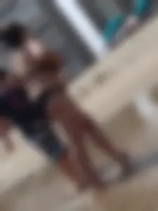 Thick beach girl in black bikini with big ass and tits