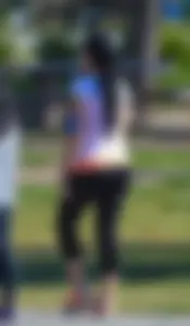 Thick lady walking in leggings with a big booty
