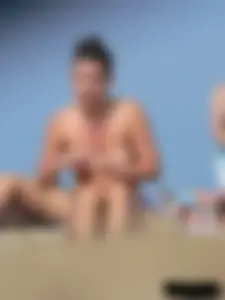 Sexy babe with a nice body topless and in a thong on the beach