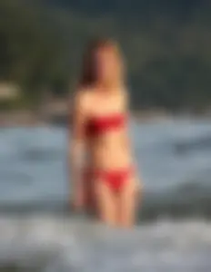 Skinny blonde babe in red bikini with camel toe and little pokies