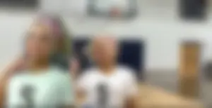 Bunch of cute college girls in bright pink shorts playing volleyball