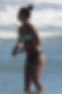 Beach girl out in a bikini with a nice round big booty