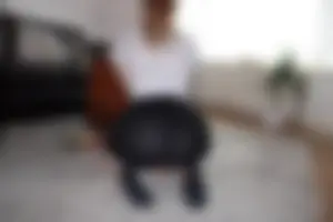 Girl in see through skirt and socks standing on her knees on the floor home creepshot