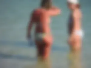 Blonde milf on the beach in her bikini